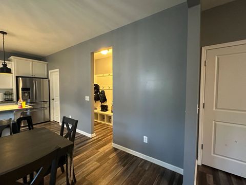 Dining area and hallway walls repainted in a blue-gray