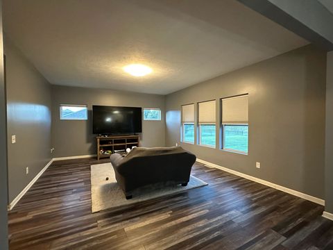 Living room repainted in gray with a bright white ceiling