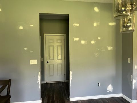 Walls spot-patched and sanded before painting