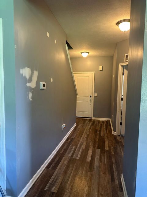 Hallway walls spot-patched ahead of fresh paint